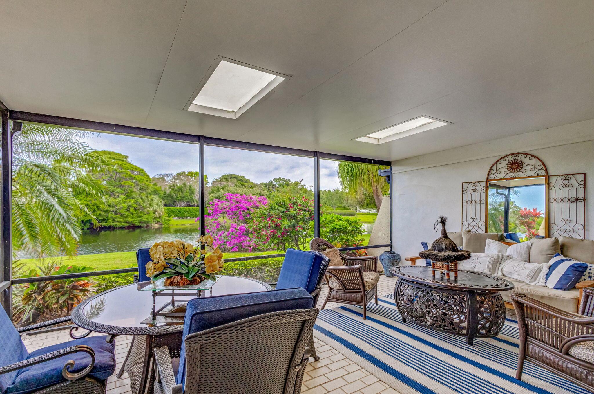 Lovely off season rental available in Jonathan's Landing for June-August 2024. This 2 bedroom, 2 bathroom villa features an updated kitchen with granite countertops, a furnished lanai including a fire pit and grill, and tranquil lake views from the kitchen, living room, and master bedroom.