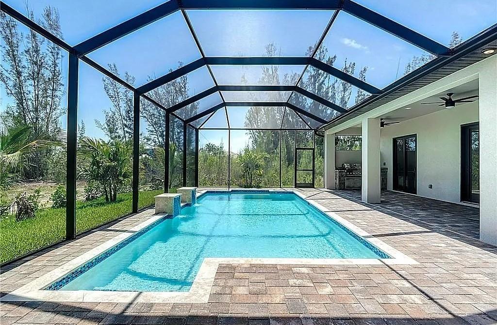 ONLY 2 MONTHS TO MOVE IN to a LUXURY & PEACEFUL home in an EXCLUSIVE Cape Coral neighborhood. This 2,121 sqft ranch-style home offers NATURAL LIGHT EVERYWHERE, modern elegance, and TOTAL PRIVACY — NO SIDE OR REAR NEIGHBORS. CHEF’S KITCHEN with quartz countertops, 3 spacious bedrooms, HIGH-IMPACT WINDOWS, and dual room-darkening shades. OVERSIZED 3-CAR GARAGE, screened lanai, LED-LIT POOL WITH WATERFALLS, and OUTDOOR GRILL. Includes FULL-HOUSE REVERSE OSMOSIS SYSTEM, HIGH-SPEED INTERNET, and VIVINT SECURITY WITH CAMERAS. Landlord may include 85" TV and patio furniture.
