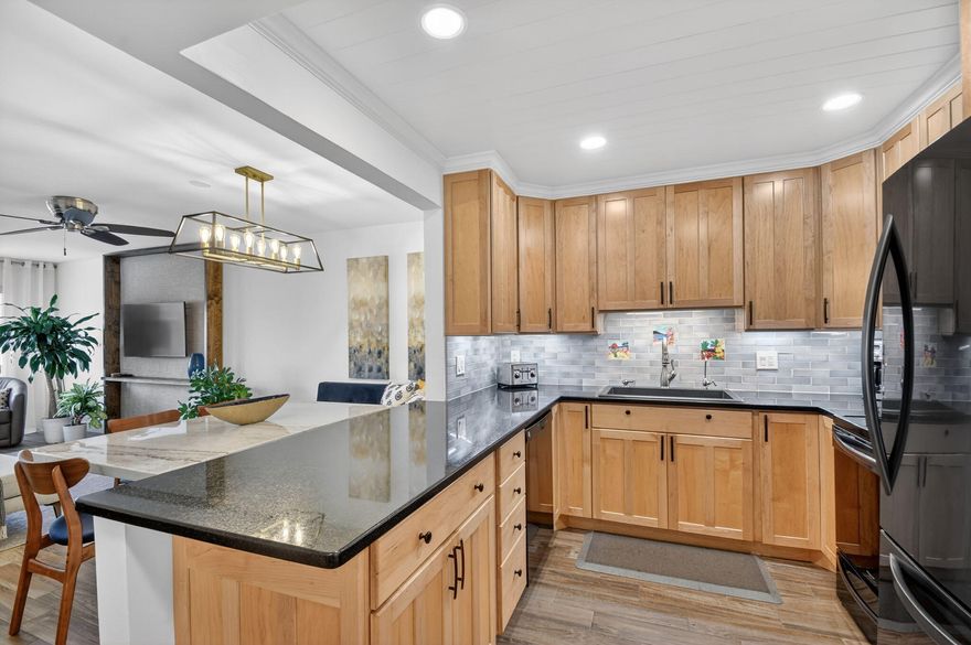 Experience sophisticated coastal living in this exquisitely remodeled 2-bed/2-bath condo, perfectly positioned on the second floor with northeast Intracoastal views. Impact glass windows flood the open-concept living space with natural light, highlighting wood-look tile flooring, custom wood cabinetry, granite countertops, and premium LG appliances. Both luxurious bathrooms feature walk-in showers, and both bedrooms offer ample walk-in closets. Located in a secure, senior community, residents enjoy a resort-style heated pool with direct Intracoastal view, beach area, community room with billiard table and saunas - an elegant sanctuary for waterside living. Relax on your large screened-in balcony or drive to nearby restaurants, shops, and beaches.  Minutes from I95 and the airport.