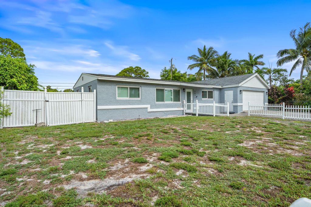 Photo of 2071 W Carrol Circle, West Palm Beach, FL 33415 (MLS # R11098865)