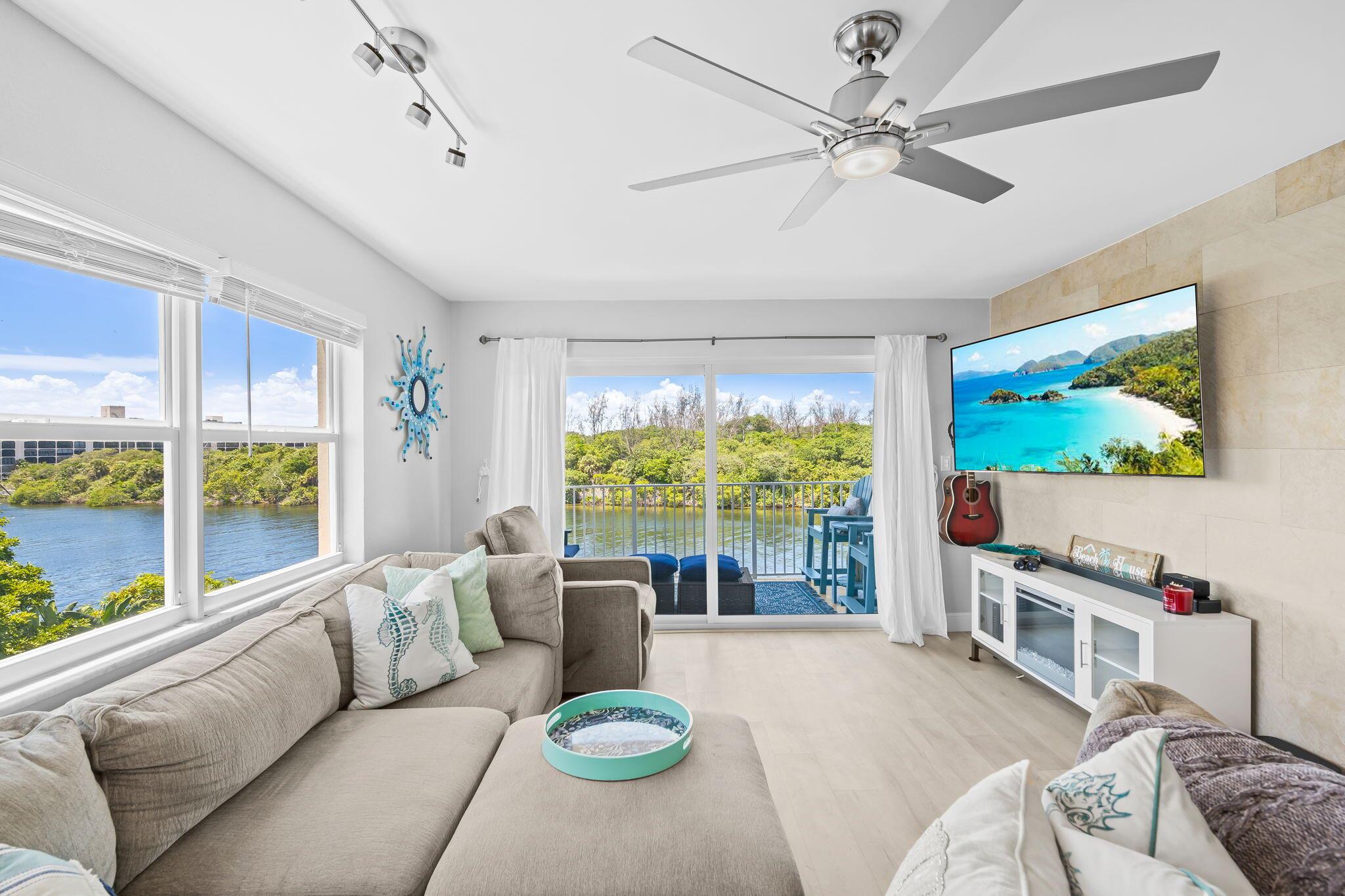 Beautiful fully updated condo just blocks to the beach, beach area shops and restaraunts. Features include: Newer kitchen, open balcony with stunning views of the intracoastal and uninhabited Deerfield Island, top floor end unit full of windows and light, frequent neighbor gatherings at the pool, magnificent sun sets over the island, a stunning boat show passing by everyday!