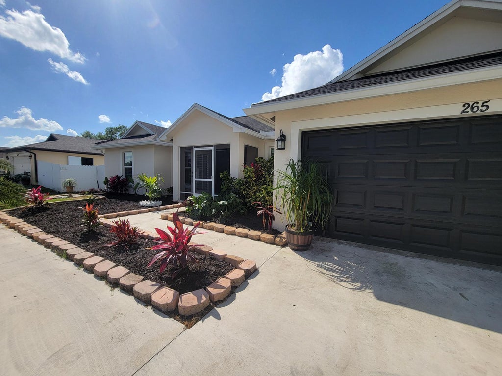 Photo of 265 SW Tulip Boulevard, Port Saint Lucie, FL 34953 (MLS # R11072486)