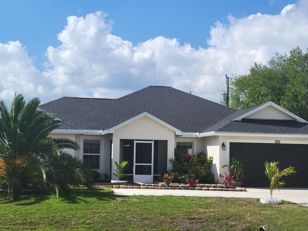 Photo of 265 SW Tulip Boulevard, Port Saint Lucie, FL 34953 (MLS # R11072486)