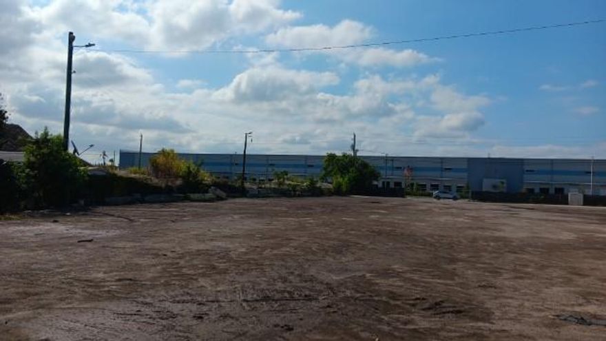 Vacant land with fence included. Any other unattached property currently on the lot does not convey.