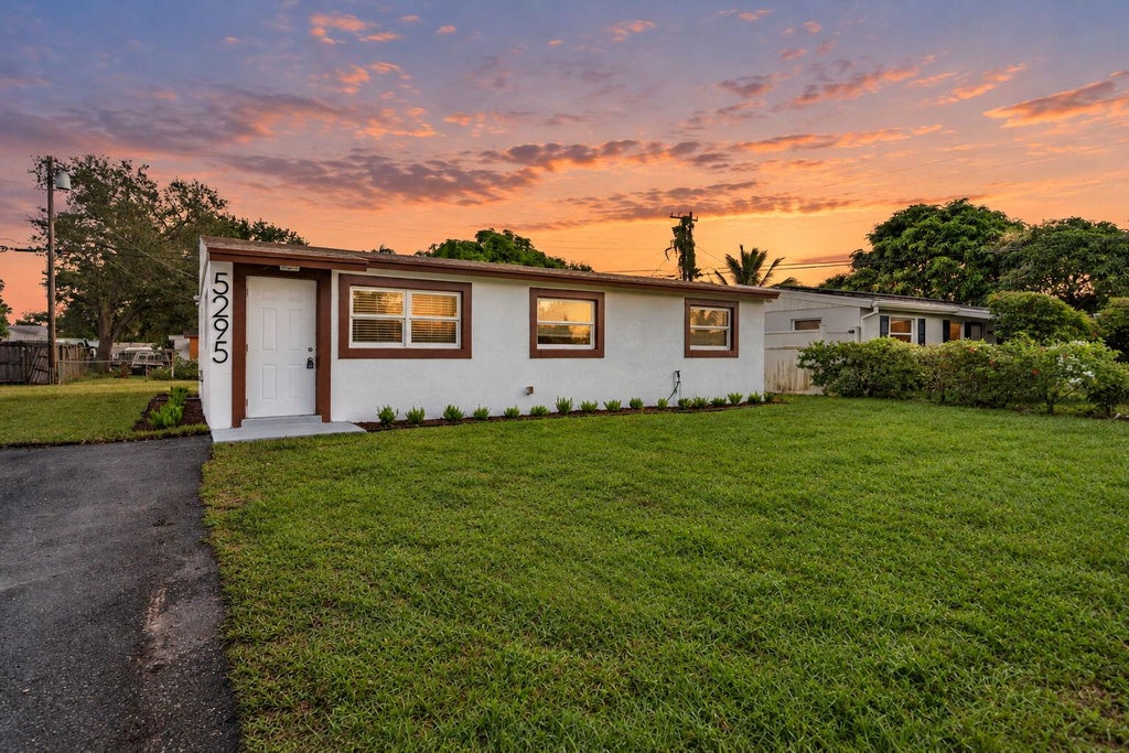 Photo of 5295 HELENE Place, West Palm Beach, FL 33407 (MLS # B26085582)