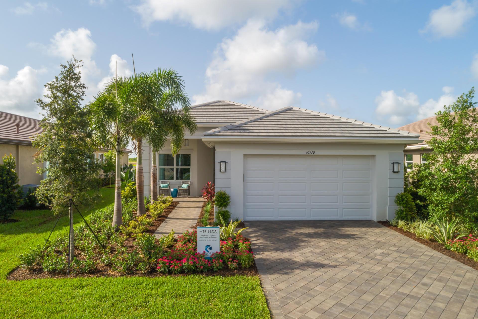 Builder closeout special. Valencia Grove at Riverland is where you'll find Port St. Lucie's best 55+ lifestyle with a million ways to have fun including a beautiful 34,000-square foot Clubhouse with resort-style amenities. This Tribeca floorplan includes private views and an open floor plan with contemporary porcelain 24''x24'' matte tile flooring throughout the main living areas. The home features high end finishes including impact glass windows, GE Profile gas appliances, tile roof, and recessed LED lighting. The spacious kitchen includes high end quartz countertops and full quartz backsplash, painted gray mist maple cabinets, custom cabinet pantry built-in, above and below cabinet lighting, crown molding and