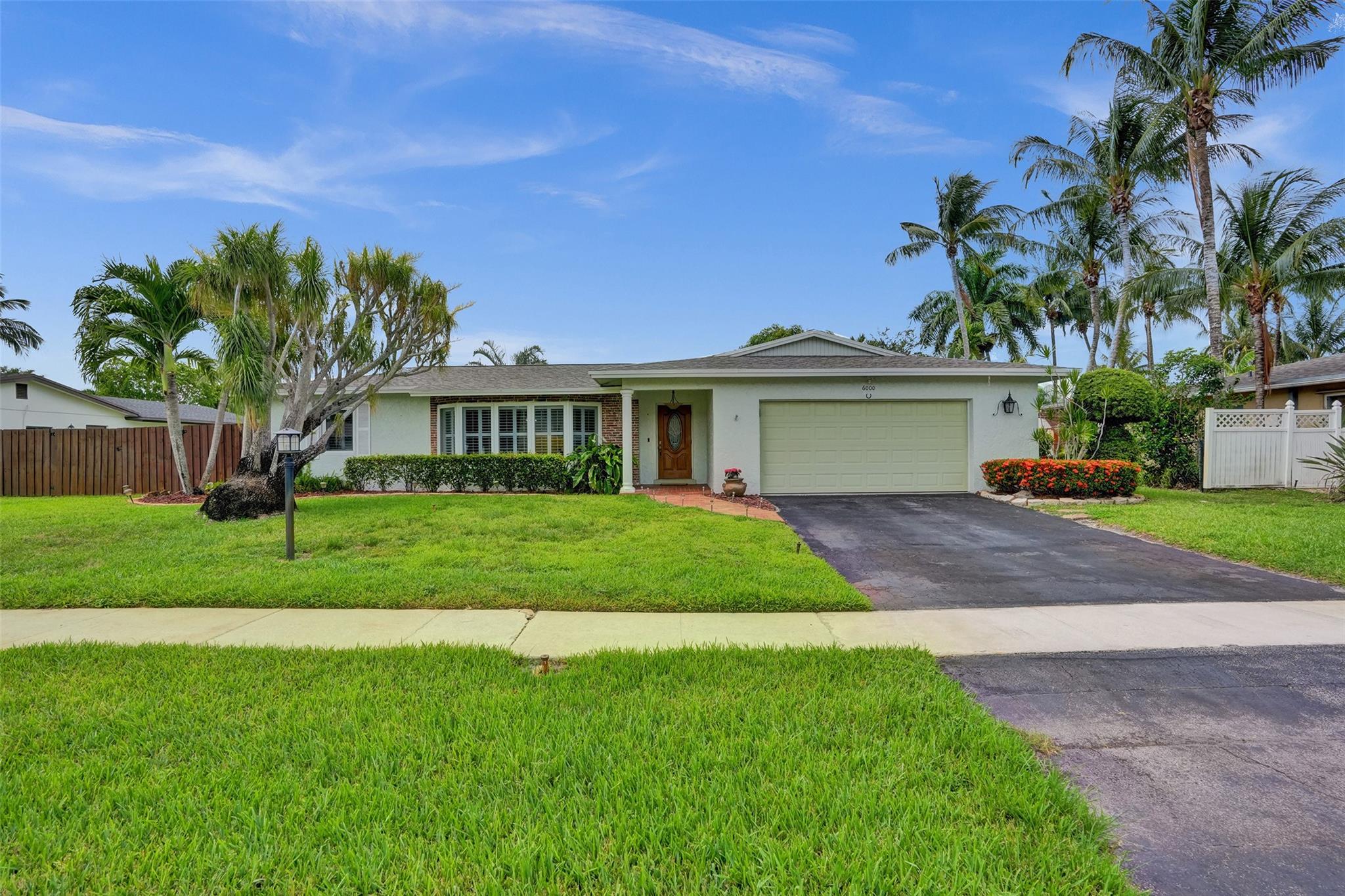 RARE OCEAN ACCESS! Welcome to Plantation Isles—one of Plantation’s most sought-after waterfront communities. BOATERS PARADISE! South Florida pool home on nearly 1/3 acre and offers 3 bedrooms, 2 baths, a 2022 roof and FULL hurricane protection with IMPACT WINDOWS & DOORS, plus a wind-rated garage door.
Enjoy your private dock, deepwater access, and a fenced yard with room for a boat or RV, all within a backyard oasis featuring fruit trees, a screened patio, and sparkling pool. Interior highlights include new porcelain tile, smooth ceilings with recessed lighting, and PLANTATION SHUTTERS The kitchen and baths are tastefully updated and move-in ready.
Updated electrical panel,NO HOA,quiet cul-de-sac,family-friendly neighborhood,near parks, top-rated schools, major highways, Airport.