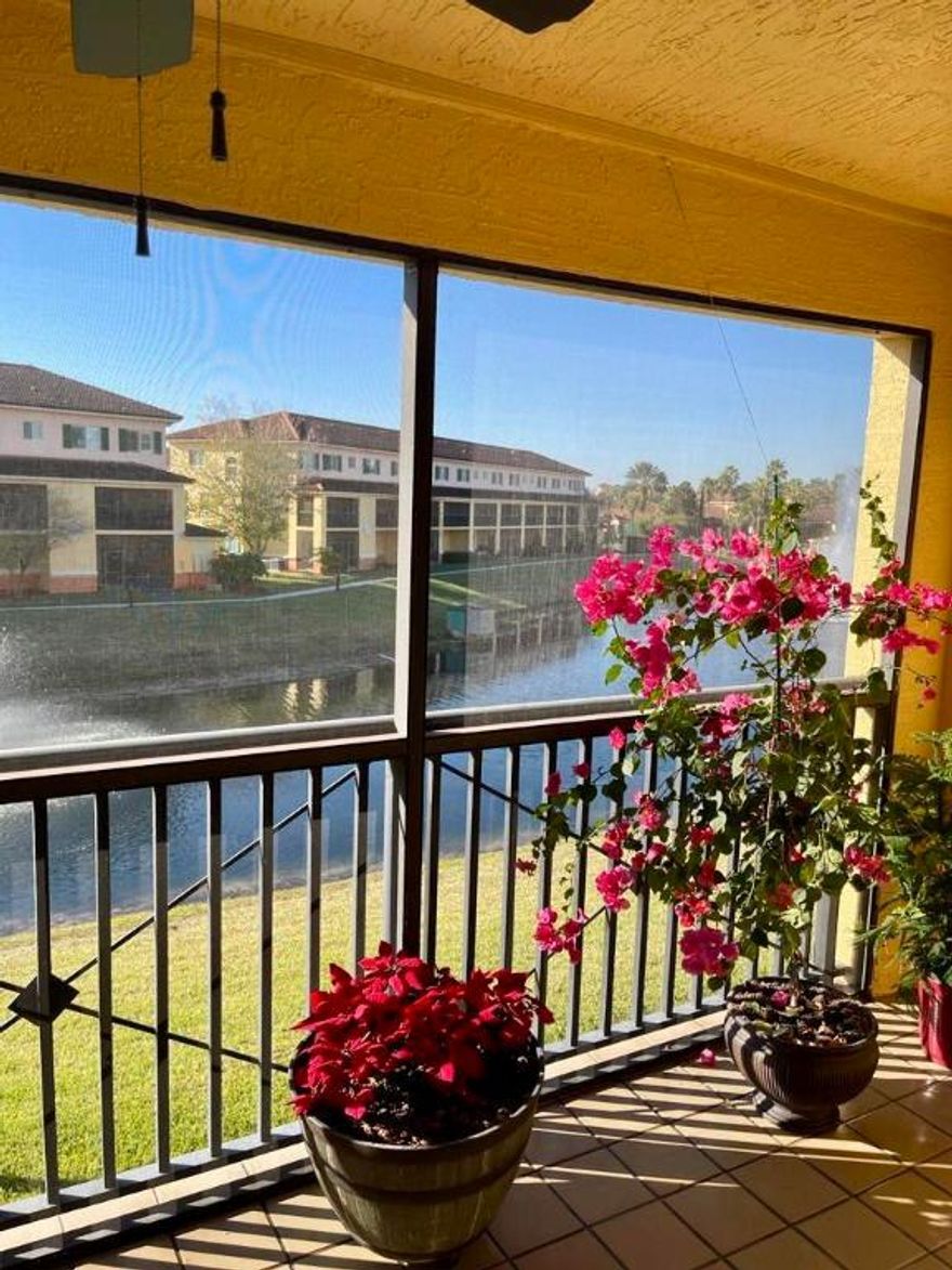 Beautifully maintained condo in the desirable Villagio  community featuring gorgeous wood floors and a peaceful lake view. Enjoy a bright, open living space with a private screened patio overlooking the water,  perfect for relaxing or entertaining. Villagio offers a gated, resort-inspired lifestyle with a pool, fitness center, clubhouse, and lush landscaping, all conveniently located near shopping, dining, and major roadways.