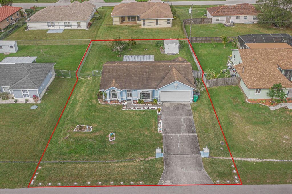 Photo of 5489 NW Evanston Avenue, Port Saint Lucie, FL 34983 (MLS # R10951893)