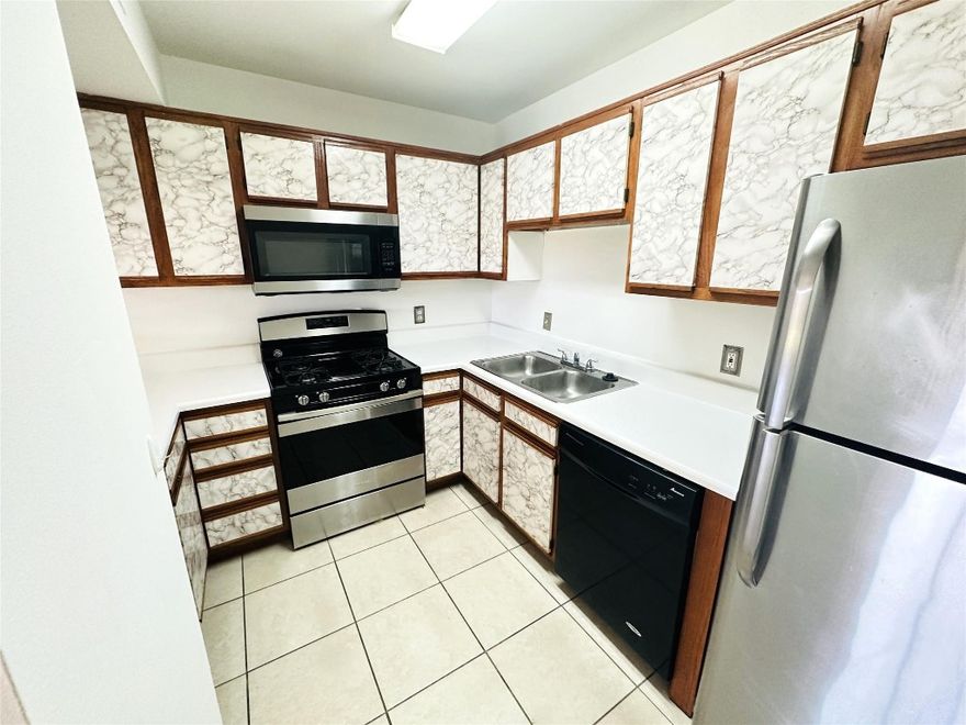 Don't miss this beautifully maintained one-bedroom, one-bath apartment located on the third floor in the desirable Hammocks Trails community. Featuring a bright, open layout with tile flooring throughout. The kitchen is equipped with SS appliances and offers plenty of cabinet space for convenience. Enjoy the comfort of your in-unit washer and dryer, a walk-in closet, and ample storage space throughout. Step out onto your large screened balcony, perfect for relaxing or entertaining. One assigned parking space is included, and water is covered in the rent. Residents of Hammocks Trails enjoy excellent amenities, including a swimming pool, gym, volleyball court, and a beautiful lake. Conveniently located just minutes from Baptist Hospital, shopping, and dining.