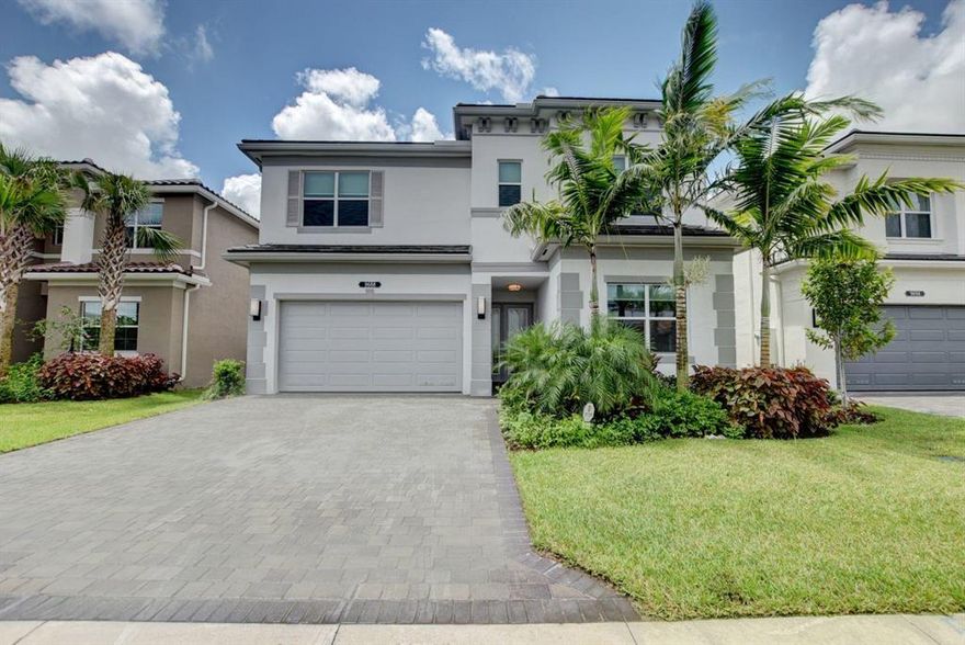 Dakota of Delray Beach's much desired Resort Style Community is appointed with Lush Landscape and offers a Private Residential Community with 24/hr Manned Gatehouse, Full Time Lifestyle Director, Heated Pool, Jacuzzi, Kids Splash Park,Tennis, Pickleball, Basketball, Playground, Indoor Sports Court, Fitness Ctr, Event Room and More. Living in Dakota will offer you and your family Country Club Living without the equity membership fees. This beautiful home offers an open floor plan with upgrades galore which incl built in wall unit in Family Room, State of the Art Kitchen with Quartz Counter and Decorative Backsplash.  First impressions will wow you,