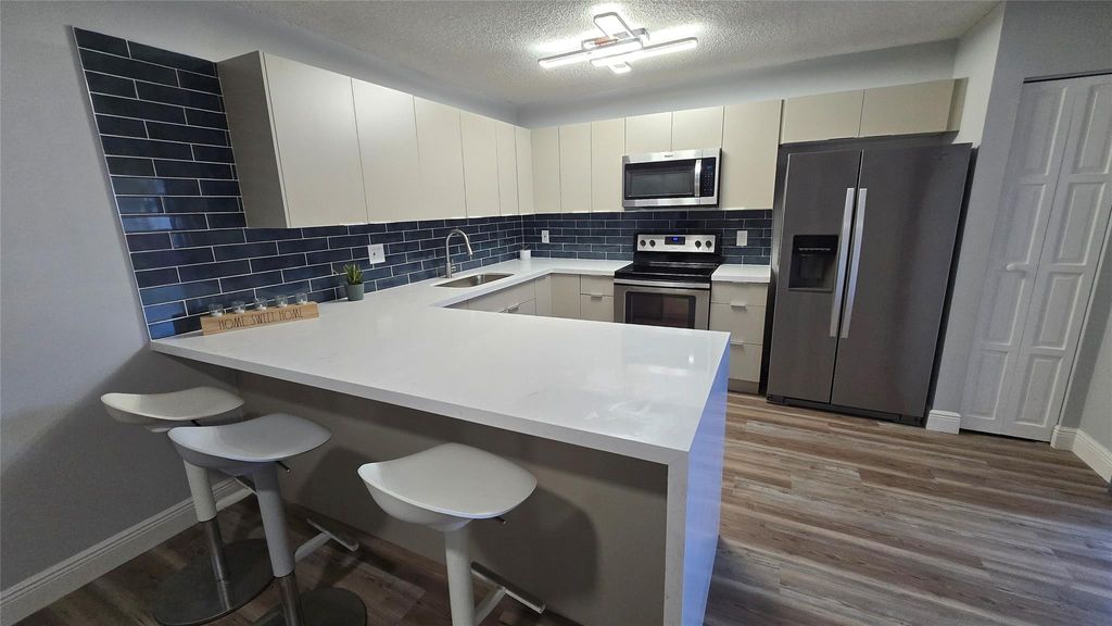 Photo of 8900 SW 20th Place #A, Davie, FL 33324 (MLS # F10552535)