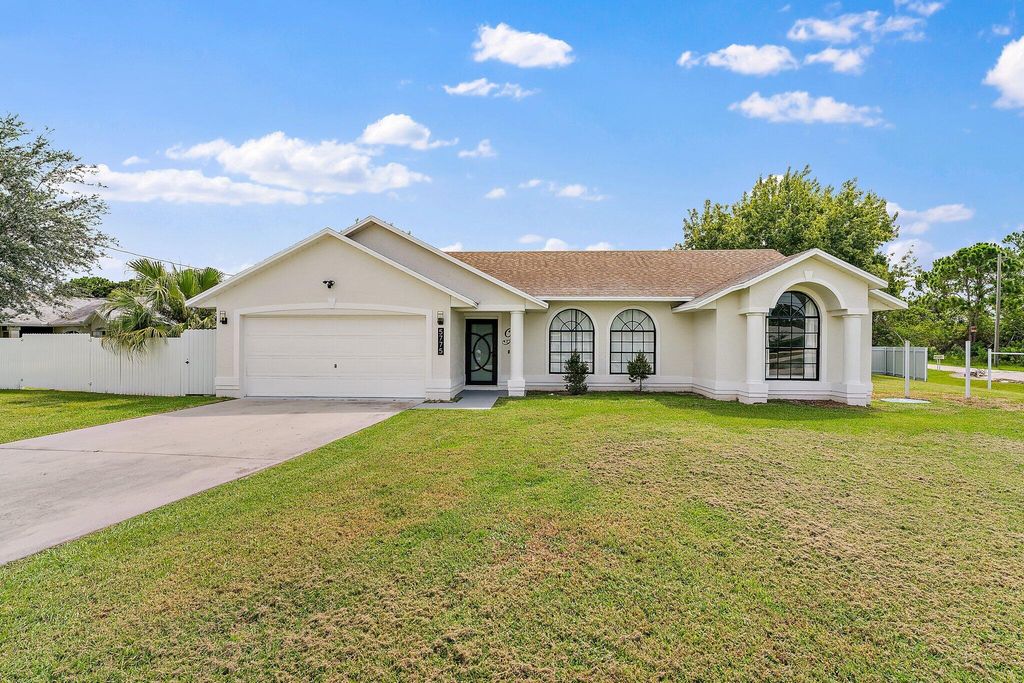 Photo of 5775 NW Zinnia Street, Port St Lucie, FL 34986 (MLS # R10901655)