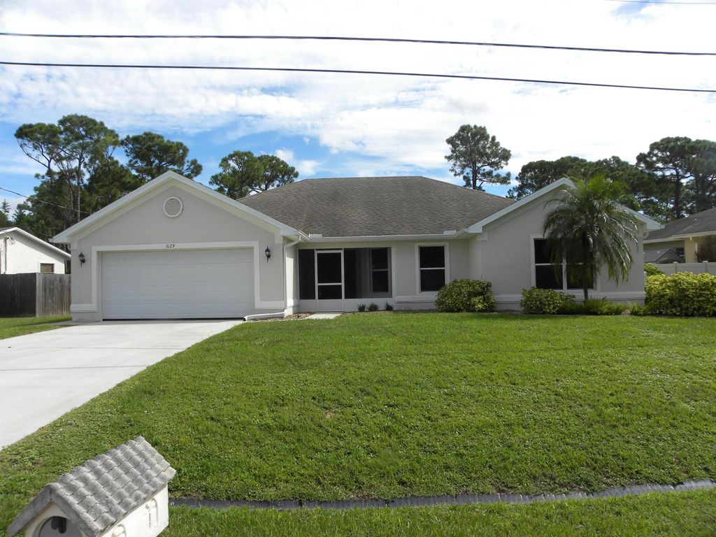Photo of 3129 SW Collings Drive, Port St Lucie, FL 34953 (MLS # R10915848)