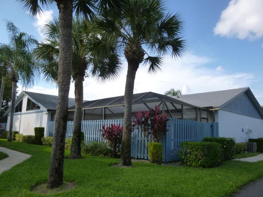 Unique 2 BR, 2 BA villa with all the right touches!!  Remodeled Kitchen & baths, porcelain tile flooring on  diagonal, new baseboards, several new interior doors,  new ext. paint Dec. ’15,  Vaulted ceilings in main living areas & master BR, large screen patio w/decorative textured surface, privacy fencing, cabana bath, interior laundry closet.  Kitchen cabinets were replaced.  Blue Pearl Granite counter tops.  Stainless Steel appls.  Remodeled baths w/new vanities  and granite inlays in showers. A/C replaced '12  Interior was repainted.  HOA fee is $160.mon and includes basic cable, lawn care, com. clubhouse and swimming pool.  2 parking spots+ guest parking.  This unit is located in a quiet section of the community, away from Jog RD.  Just few steps to the lake…..a very tranquil settin