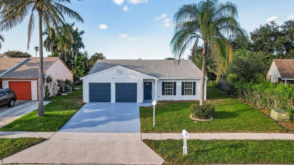 Photo of 7867 Ridgewood Dr, Lake Worth, FL 33467 (MLS # F10532024)