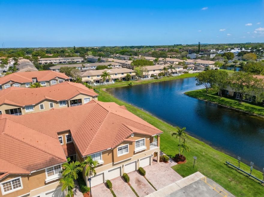 Priced to sell! Beautifully maintained 2BR/2BA corner-unit townhome with a 1-car garage in the gated community of Hampton Hills. This bright, open-concept home features a spacious living area filled with natural light, ideal for everyday living and entertaining. The kitchen offers ample cabinetry, generous counter space, and a breakfast bar overlooking the main living area. The oversized primary suite includes an updated bath and provides a comfortable retreat. Enjoy peaceful lake views along with great curb appeal and a paved driveway. Community amenities include a clubhouse, heated pool, fitness center, and playground. Conveniently located near shopping, dining, and major roadways. Don't miss this opportunity!