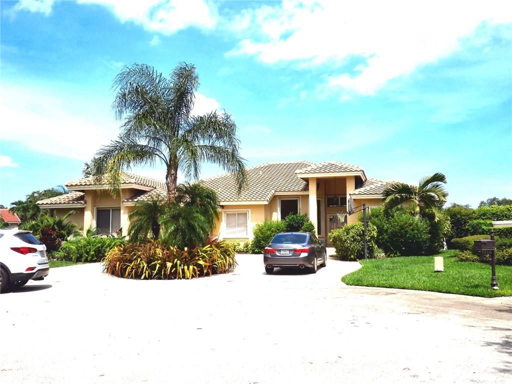 Photo of 5911 NW 63rd Pl, Parkland, FL 33067 (MLS # F10333191)