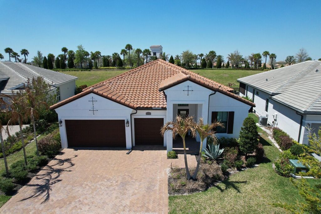 Photo of 9204 SW Arco Way, Port Saint Lucie, FL 34987 (MLS # B26008123)