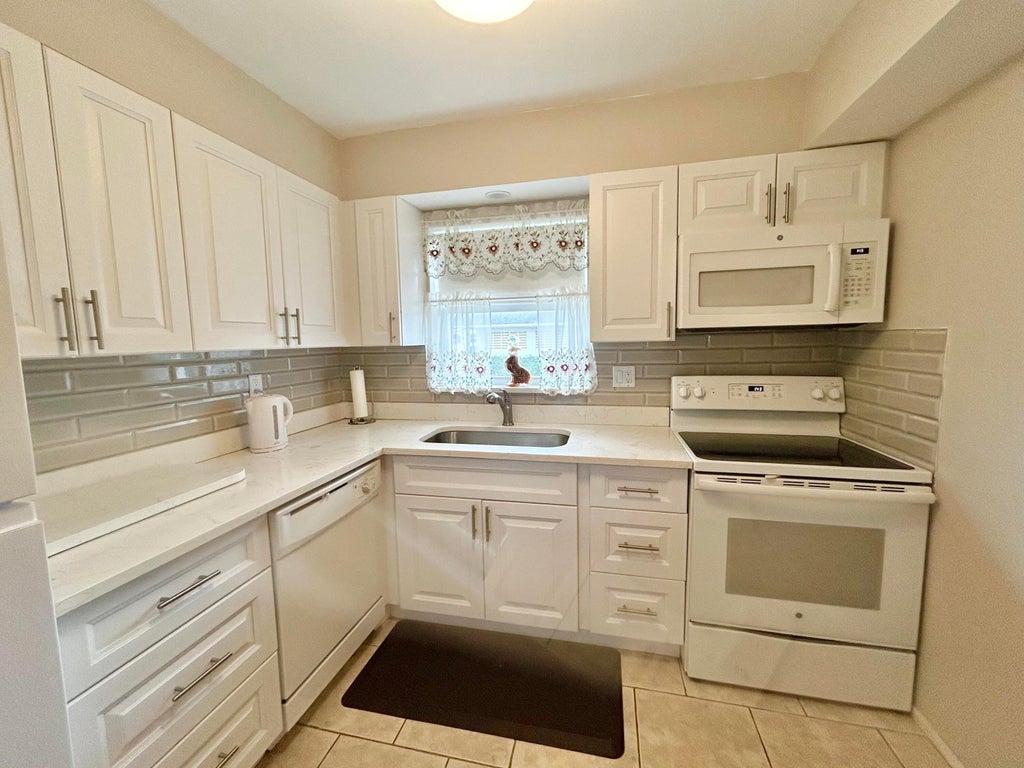 Photo of 2666 Emory Drive E #D, West Palm Beach, FL 33415 (MLS # B26080851)