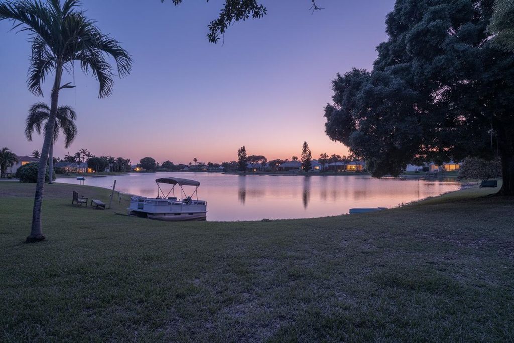 Photo of 7040 Peninsula Lake Court, Lake Worth, FL 33467 (MLS # B26002170)