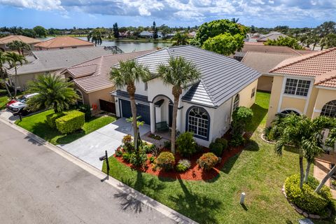 Photo of 7040 Peninsula Lake Court, Lake Worth, FL 33467 (MLS # B26002170)