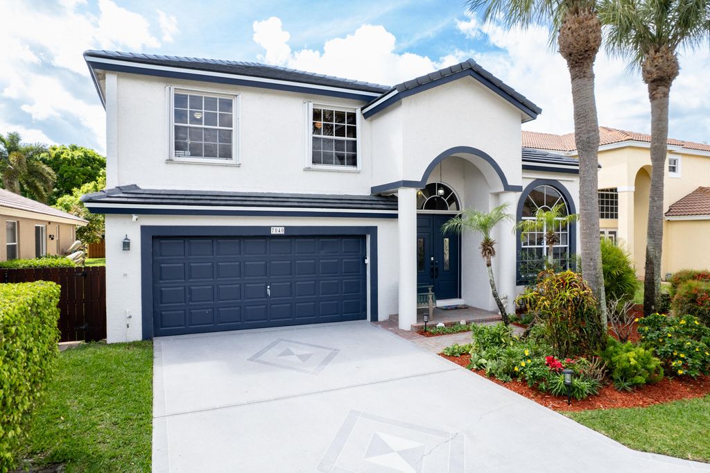 Photo of 7040 Peninsula Lake Court, Lake Worth, FL 33467 (MLS # B26002170)