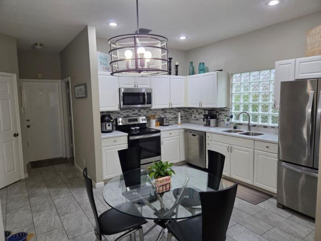 Photo of 2724 Pointe Circle, Greenacres, FL 33413 (MLS # R11125769)