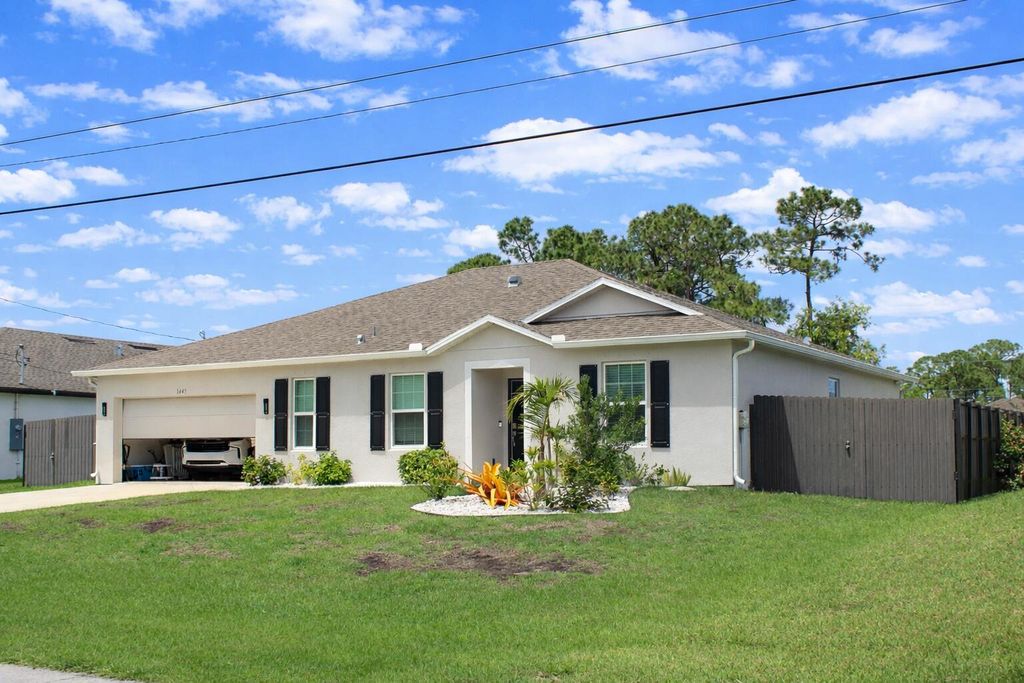 Photo of 1443 SW Gadsan Avenue, Port Saint Lucie, FL 34953 (MLS # B26012880)