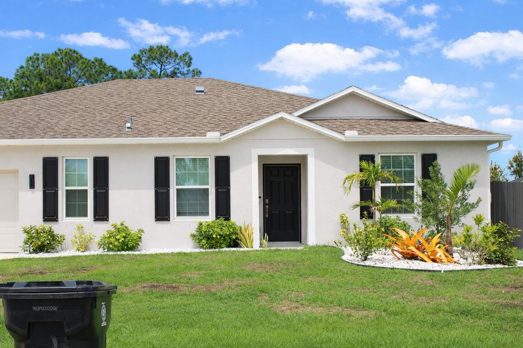 Photo of 1443 SW Gadsan Avenue, Port Saint Lucie, FL 34953 (MLS # B26012880)