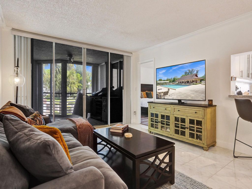 Photo of 1920 Sabal Palm Dr #206, Davie, FL 33324 (MLS # F10431218)