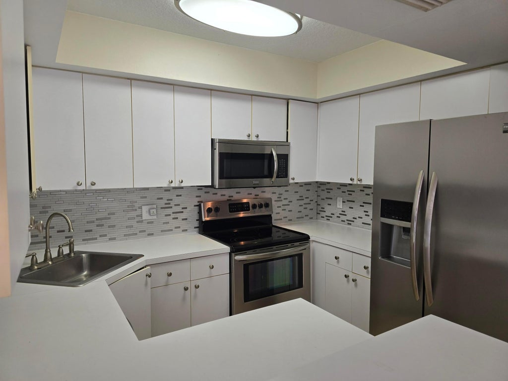Photo of 3640 Village Drive #B, Delray Beach, FL 33445 (MLS # R11074936)