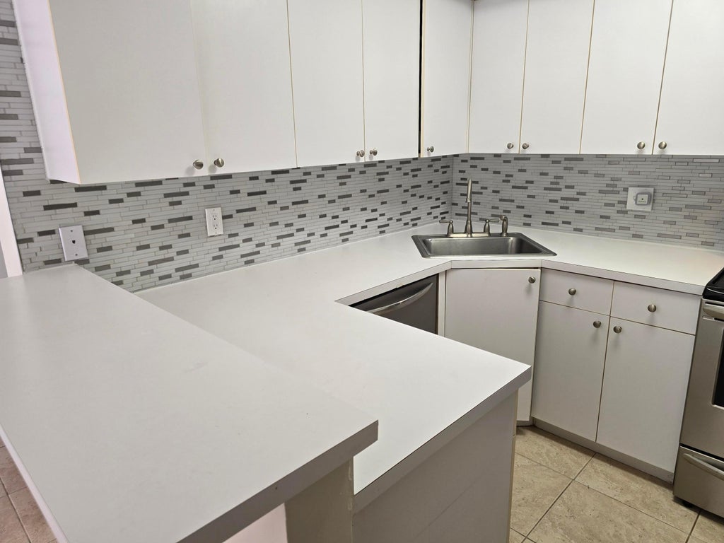 Photo of 3640 Village Drive #B, Delray Beach, FL 33445 (MLS # R11074936)