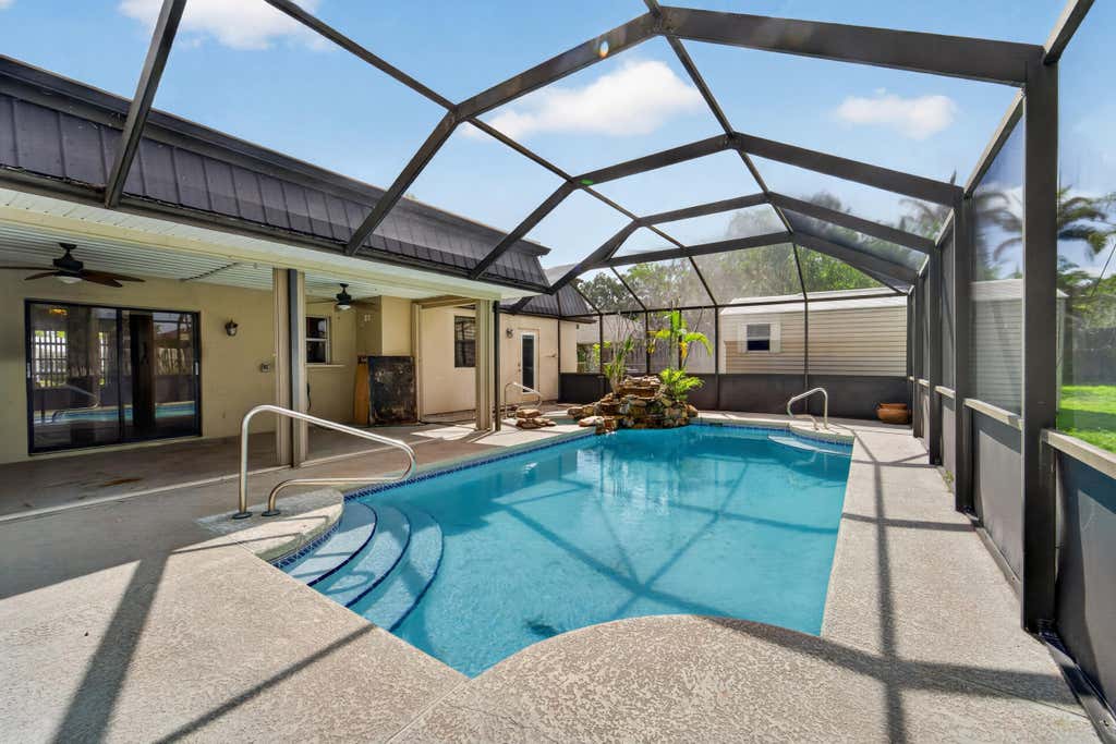 Photo of 214 NE Camelot Drive, Port Saint Lucie, FL 34983 (MLS # B26032202)