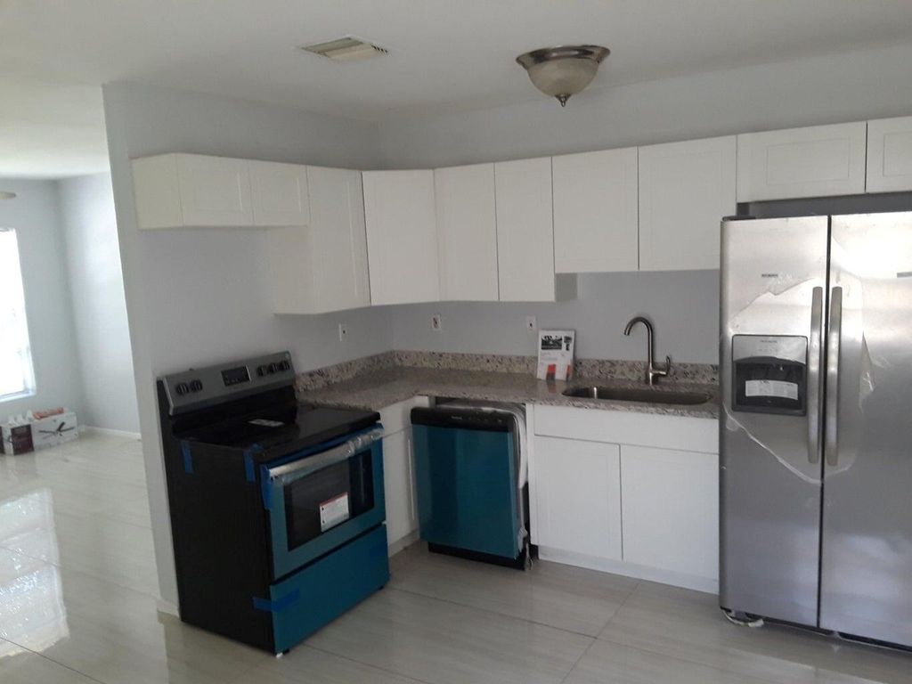 Photo of 5511 Spruce Avenue, West Palm Beach, FL 33407 (MLS # R10963301)
