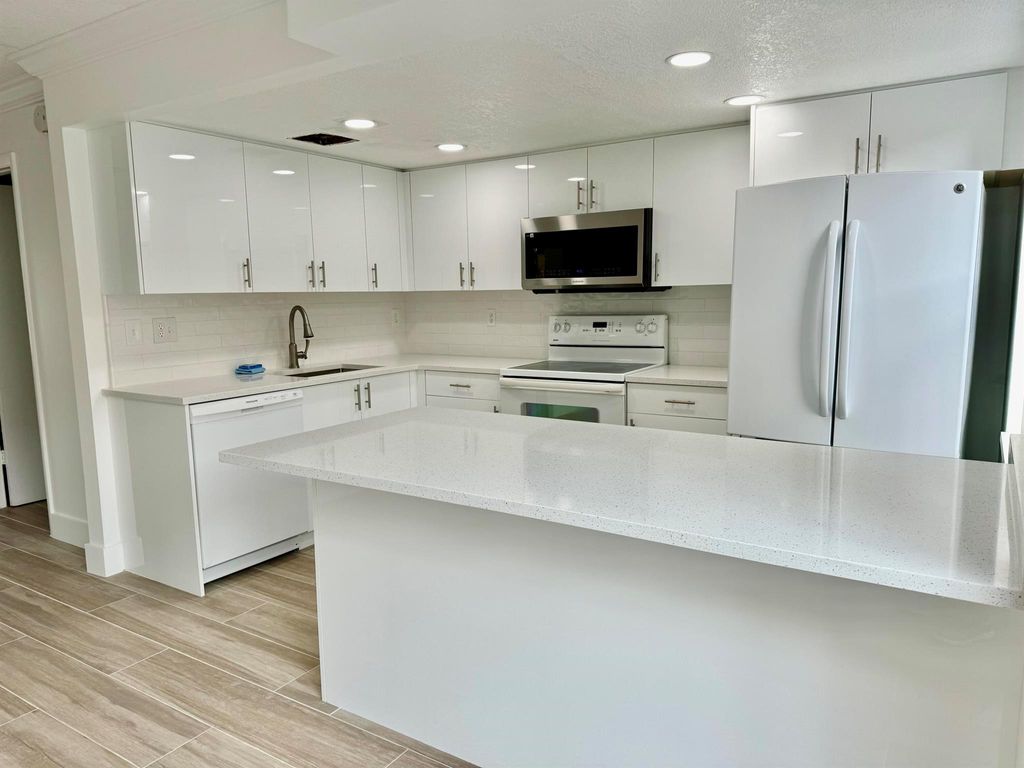 Photo of 325 Sandtree Drive, Palm Beach Gardens, FL 33403 (MLS # R11071132)