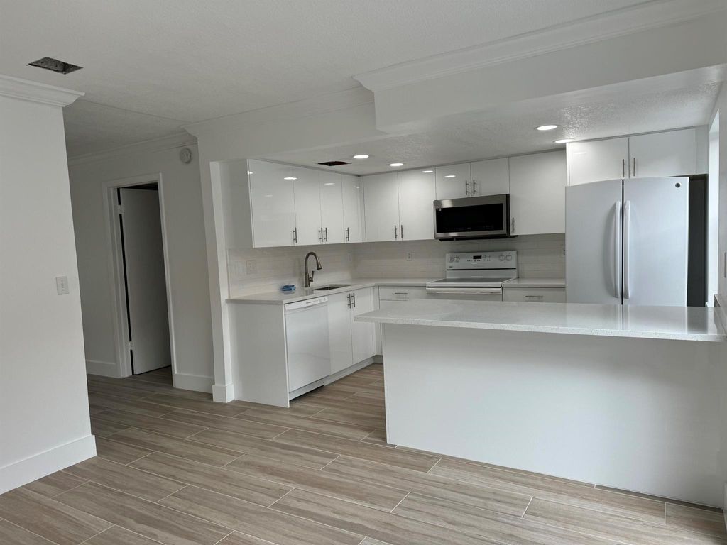 Photo of 325 Sandtree Drive, Palm Beach Gardens, FL 33403 (MLS # R11071132)