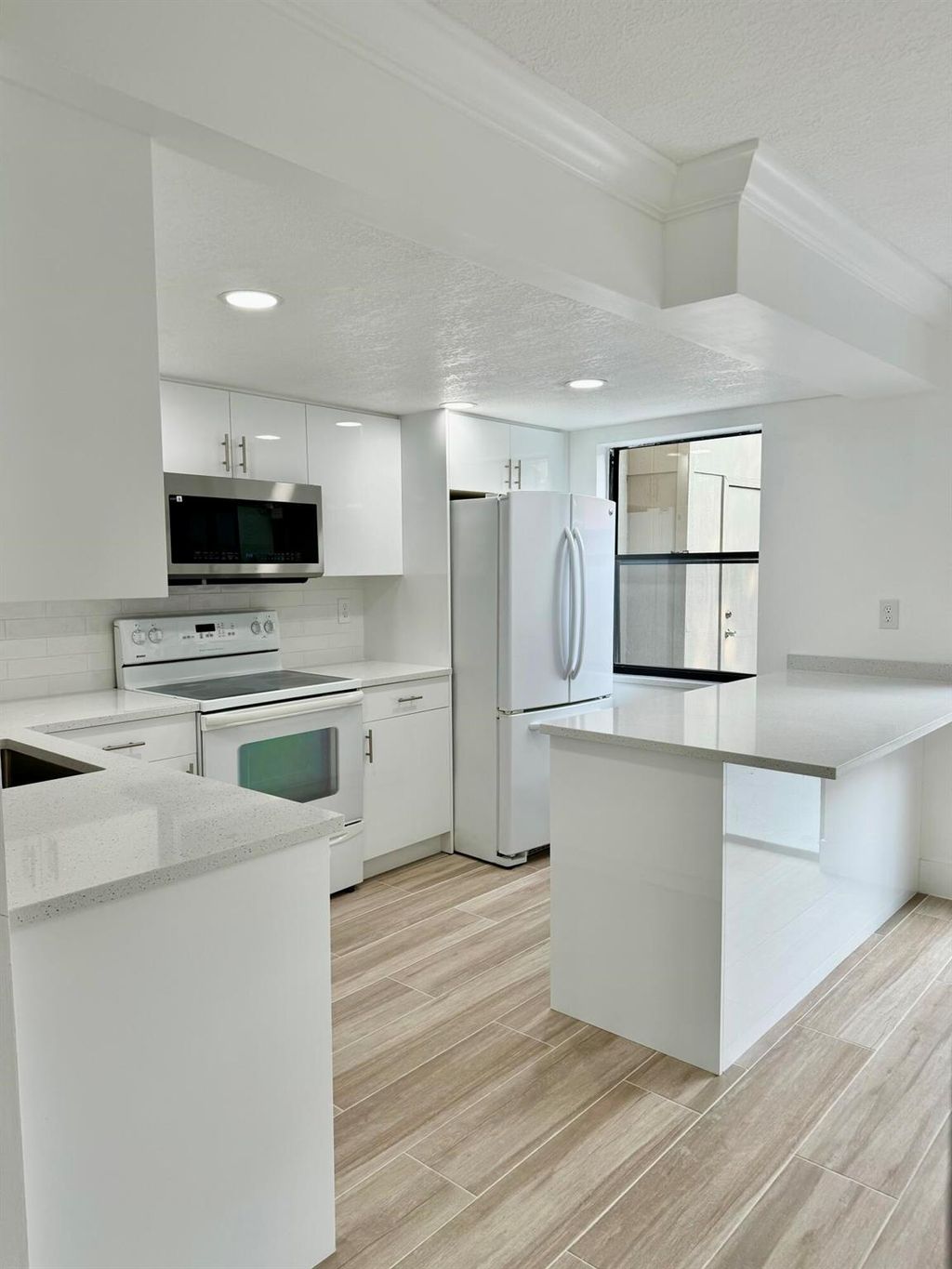 Photo of 325 Sandtree Drive, Palm Beach Gardens, FL 33403 (MLS # R11071132)