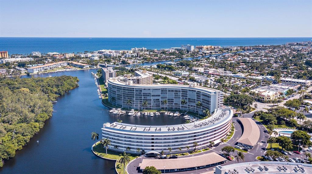 Enjoy this beautifully renovated 2 bedroom 2 bathroom condo located in the highly sought after Hillsboro Cove Community. Stunning Intracoastal water views from the moment you walk in. Each room is spacious with tile flooring throughout. Enjoy the marina views while sipping your cup of coffee in your spacious screened balcony. Recently added power hurricane shutters. Unit comes with storage space, covered parking, and plenty of guest parking. Active 55+ community with resort style pool and club house. Will not last! Florida living at its best. Minutes from the beach, shops, restaurants and more.