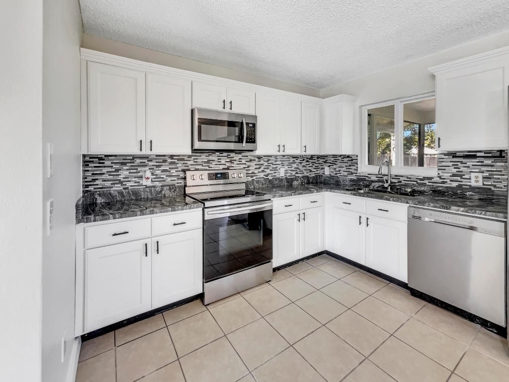 Photo of 2419 SE Marseille Street, Port Saint Lucie, FL 34952 (MLS # R10990507)