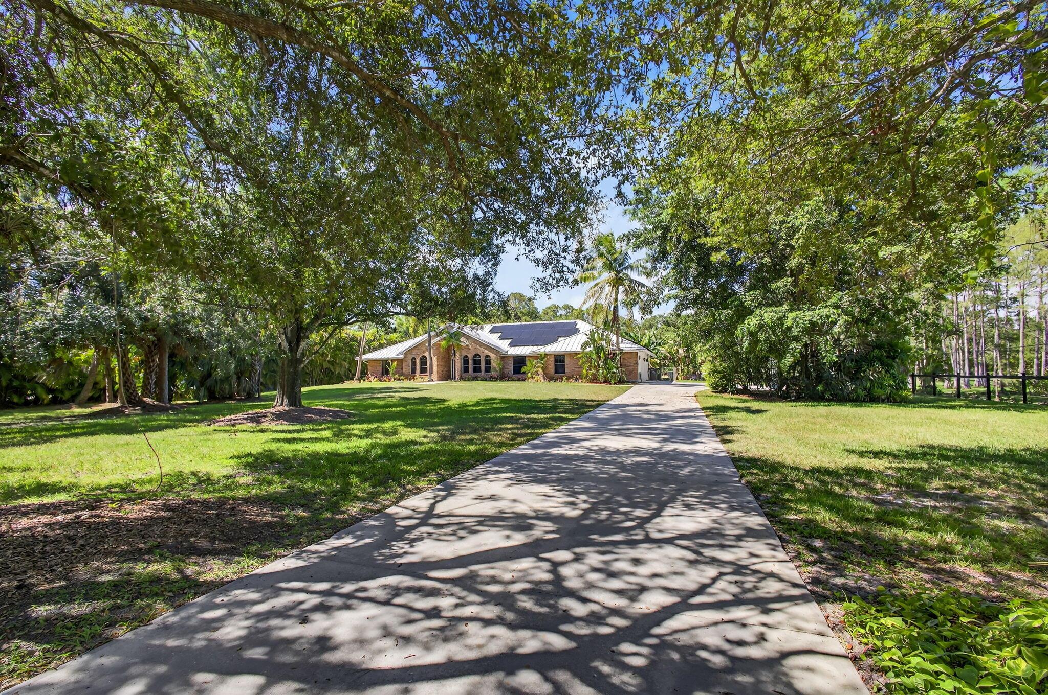 Experience unparalleled living in this gorgeous, expertly renovated CBS home in Jupiter Farms. This property presents a rare opportunity to own a meticulously reimagined residence designed for both sophisticated entertaining and relaxing family living. Nearly every component of this home has been customized in the past several years. Located conveniently just off Jupiter Farms Road, this thoughtfully upgraded 4BR, 3BA, 3-car garage split plan offers over 2,550 square feet of luxurious, energy-efficient living with ample storage. Vaulted ceilings, a stunning gourmet kitchen (2024), new LVP flooring, new baths (2025) and fresh interior paint are just a few of the interior upgrades.