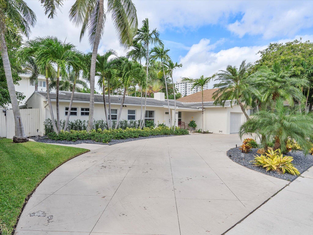 Photo of 411 Poinciana Drive, Fort Lauderdale, FL 33301 (MLS # B26012925)
