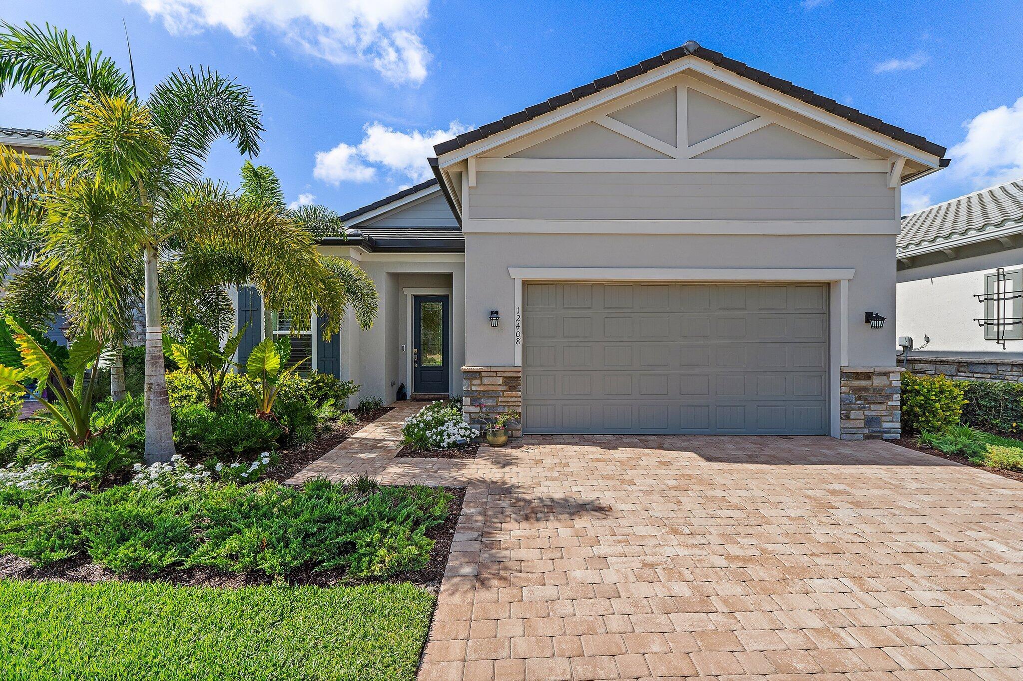 Built in 2024, this DiVosta Mainstay model home is located on a peaceful cu-de-sac.Professionally installed landscape lighting highlights the architectural & natural features of the property. Enjoy the clubhouse with state-of-the-art gym equipment, tennis courts, table tennis, a children's playground, health classes, an international-standard swimming pool, event spaces. Close to nearby shopping, fine dining, beaches, golf & PBIA. Included is the transferable 10-year limited structural warranty through DiVosta.