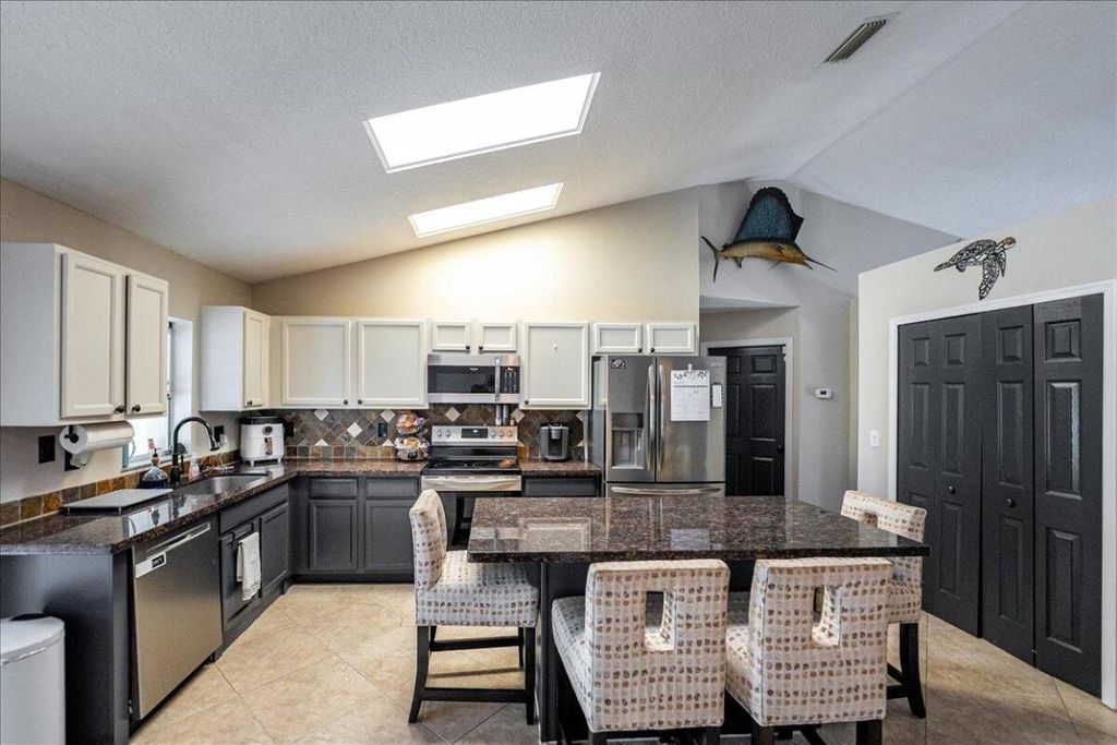 Photo of 279 SW Glenwood Drive, Port Saint Lucie, FL 34984 (MLS # R11089292)