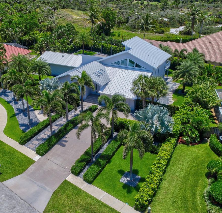 Gorgeous home close to the beach path in coveted Olympus. 5 min to Safe Harbor Marina w/deep water moorage avail.Incredible opportunity to purchase a home on almost 1/2 acre that has been elevated to the highest standards. New Roof 2024 & Low-e insulated impact glass, Euro-Modern kitchen w/luxury Miele/Bosch appliances incl. steam oven, espresso machine. Imported porcelain floors throughout. Primary suite w/coffee bar, custom closet, New Brazilian walnut(IPE) hardwood deck overlooking pool + preserve. 3 guest bedrooms,1 suite has seperate entry w/kitchenette- could be Primary wing. Ultimate pool (53'x25') surrounded by expansive landscape dotted w/palms. Salt system w/UV, Ozone sanitizer, Heated, LED lighting. Newer 3-zone AC system w/insulated ductwork. State-of-the-Art audio+security.