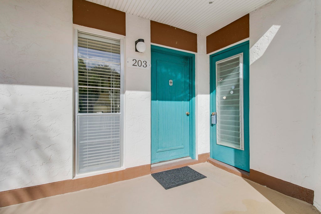 Photo of 7 GREENWAY Village N #203, Royal Palm Beach, FL 33411 (MLS # B26094893)