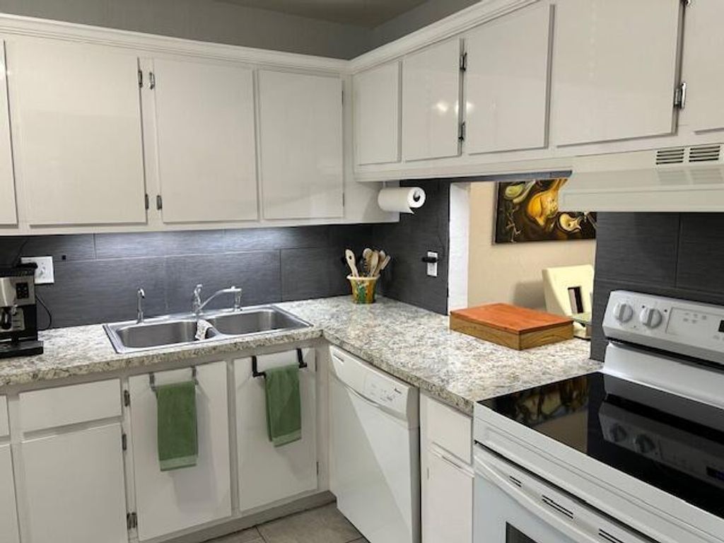 Photo of 417 Lake Evelyn Drive, West Palm Beach, FL 33411 (MLS # R11135215)