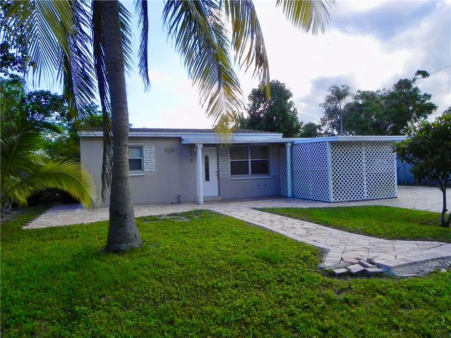 Great home in Great Neighborhood, in Collier Manor, close to US1. Can be purchased with or without tenant, perfect for the buyer who wants to live in 2 bedrooms and 1 Bath and receive immediate income from the efficiency already rented 1bed/1bath ($650) with separate entrance. New Roof, New AC, Freshly painted interior, new upgrade bathroom. Massive paver driveway for 8 cars, enjoy fruit trees in your back yard. Only a 6 minute drive to the beach.