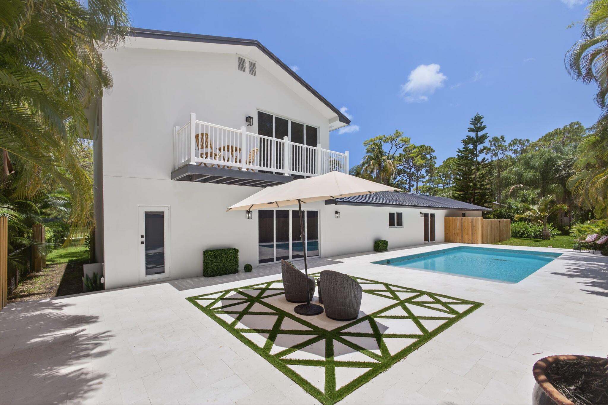 $145k under appraisal! This stunning, fully remodeled residence in the prestigious Pennock Point on almost 1/2 acre offers an unparalleled blend of luxury and coastal elegance. Boasting two primary suites, a bright and open-concept design, a brand-new roof, and impact windows, this home is crafted for both style and comfort. Step outside to your dream oasis--a resort-style pool perfect for relaxation and entertaining. Just moments from the scenic Loxahatchee River, pristine Jupiter beaches, world-class golf courses, and premier dining and shopping, this prime location has it all. With no HOA, enjoy the freedom to store your boat or RV with ease. Don't miss this rare opportunity to own a private retreat in one of Jupiter's most sought-after communities with multi-million dollar new build