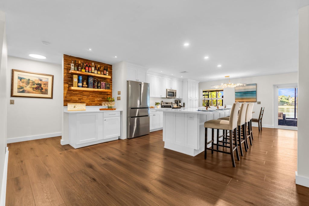 Photo of 6642 Rainwood Cove Lane, Lake Worth, FL 33463 (MLS # B26067231)